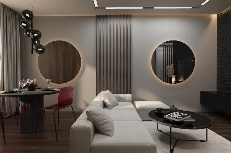 Open-plan living room with dark accent wall, statement sofa and ambient cove lighting